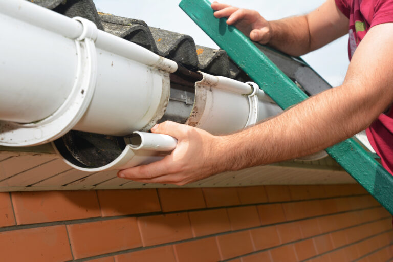 Guttering repair. Roofer contractor repair rain gutter.